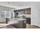 Kitchen with dark brown cabinets, granite countertops and island at 145 Clydesdale Cir, Summerville, SC 29486