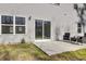 Grey siding home with a sliding glass door leading to a patio at 145 Clydesdale Cir, Summerville, SC 29486
