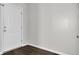 Empty spare bedroom with white door and hardwood floors at 145 Clydesdale Cir, Summerville, SC 29486