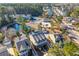 Aerial view of houses and community amenities, including a pond and pool at 1493 Nautical Chart Dr, Charleston, SC 29414