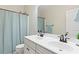 Bathroom with double vanity, shower, and decorative wallpaper at 1493 Nautical Chart Dr, Charleston, SC 29414