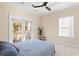 Bedroom with French doors to private balcony and ceiling fan at 1493 Nautical Chart Dr, Charleston, SC 29414