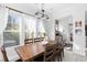 Charming dining room with a wood table and six chairs, and large windows at 1493 Nautical Chart Dr, Charleston, SC 29414