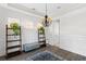 Elegant dining room featuring hardwood floors, wainscoting, and a lovely chandelier at 1493 Nautical Chart Dr, Charleston, SC 29414