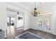 Spacious dining area with hardwood floors, access to the backyard, and a home gym view at 1493 Nautical Chart Dr, Charleston, SC 29414