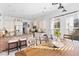 Bright dining area with wood table and view into kitchen at 1493 Nautical Chart Dr, Charleston, SC 29414