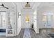 Bright and airy entryway with hardwood floors, french doors, and a view to the backyard at 1493 Nautical Chart Dr, Charleston, SC 29414