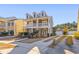 Two-story home with front porch, dormer windows, and landscaping at 1493 Nautical Chart Dr, Charleston, SC 29414