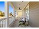 Relaxing front porch with hammock, rocking chairs, and neighborhood view at 1493 Nautical Chart Dr, Charleston, SC 29414