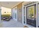 Inviting front porch with black door and wicker seating at 1493 Nautical Chart Dr, Charleston, SC 29414