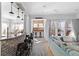 Open kitchen with breakfast bar, stainless steel appliances, and exposed brick at 1493 Nautical Chart Dr, Charleston, SC 29414