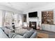 Spacious living room with fireplace and large windows at 1493 Nautical Chart Dr, Charleston, SC 29414