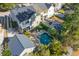 An aerial view of a kidney-shaped pool with a patio area at 1493 Nautical Chart Dr, Charleston, SC 29414