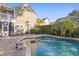 Relaxing freeform pool with brick patio and surrounding greenery at 1493 Nautical Chart Dr, Charleston, SC 29414