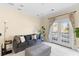Sitting room with French doors to balcony and plush seating at 1493 Nautical Chart Dr, Charleston, SC 29414