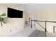 Spacious upper hall with large TV, sitting area, and staircase at 1493 Nautical Chart Dr, Charleston, SC 29414