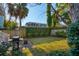 Large backyard with grill, patio, and mature trees at 17 H St, Charleston, SC 29403