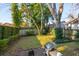 Private backyard with grassy lawn and brick patio at 17 H St, Charleston, SC 29403