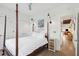 Spacious bedroom with four-poster bed, hardwood floors, and access to other rooms at 17 H St, Charleston, SC 29403