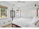 Bright bedroom with a wooden four-poster bed and ample closet space at 17 H St, Charleston, SC 29403