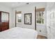 Well-lit bedroom featuring a four-poster bed and access to private yard at 17 H St, Charleston, SC 29403