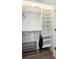 Spacious walk-in closet with built-in shelves and hanging rods at 17 H St, Charleston, SC 29403