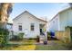 White house exterior and a small backyard at 17 H St, Charleston, SC 29403