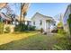 White house exterior with a spacious backyard at 17 H St, Charleston, SC 29403