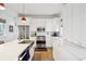 Modern kitchen with white cabinets, stainless steel appliances, and quartz countertops at 17 H St, Charleston, SC 29403