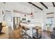 Modern white kitchen with stainless steel appliances and an island at 17 H St, Charleston, SC 29403