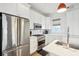Bright kitchen featuring stainless steel appliances and white shaker cabinets at 17 H St, Charleston, SC 29403