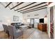 Spacious living room featuring exposed beams, hardwood floors, and comfortable seating at 17 H St, Charleston, SC 29403