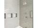 Shower with gray tile and built-in niches at 17 H St, Charleston, SC 29403