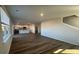 Open-concept living room with hardwood floors and kitchen view at 185 Carolina Groves Blvd, Moncks Corner, SC 29461