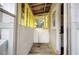 Small back porch with yellow accents and wooden flooring at 1902 Kerry St, North Charleston, SC 29406