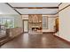 Spacious living room featuring a brick fireplace and wood-look tile floors at 202 Hunt Club Dr, Summerville, SC 29485