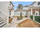 Charming backyard with stone pathway, landscaping, and a fire pit at 2021 Codorus Ln, Hanahan, SC 29410