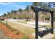 Relaxing community park featuring a swing, basketball court, and open green space at 2021 Codorus Ln, Hanahan, SC 29410