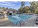 Inviting community pool with ample lounge chairs and shade structures at 2021 Codorus Ln, Hanahan, SC 29410
