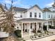 Two-story white house with a gray roof and a covered porch at 2021 Codorus Ln, Hanahan, SC 29410