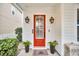 Red front door with black accents and sidelights at 2021 Codorus Ln, Hanahan, SC 29410