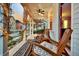 Relaxing front porch with rocking chairs and string lights at 2021 Codorus Ln, Hanahan, SC 29410