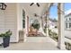 Spacious front porch with rocking chairs and ceiling fan at 2021 Codorus Ln, Hanahan, SC 29410