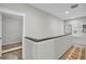 Upstairs hallway with neutral walls, carpet, and a small window at 2021 Codorus Ln, Hanahan, SC 29410