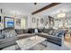 Large living room with sectional sofa and kitchen view at 2021 Codorus Ln, Hanahan, SC 29410