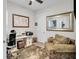 Home office with a comfortable sitting area and built-in workspace at 2021 Codorus Ln, Hanahan, SC 29410