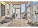 Cozy screened porch furnished with comfortable seating and a coffee table at 2021 Codorus Ln, Hanahan, SC 29410