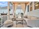 Relaxing screened porch with seating area, creating an outdoor oasis at 2021 Codorus Ln, Hanahan, SC 29410