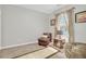 Serene sitting area with a leather chair and rug at 2021 Codorus Ln, Hanahan, SC 29410
