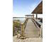 Long wooden dock leads to gazebo over calm water at 203 Cynthia Ln, Charleston, SC 29407